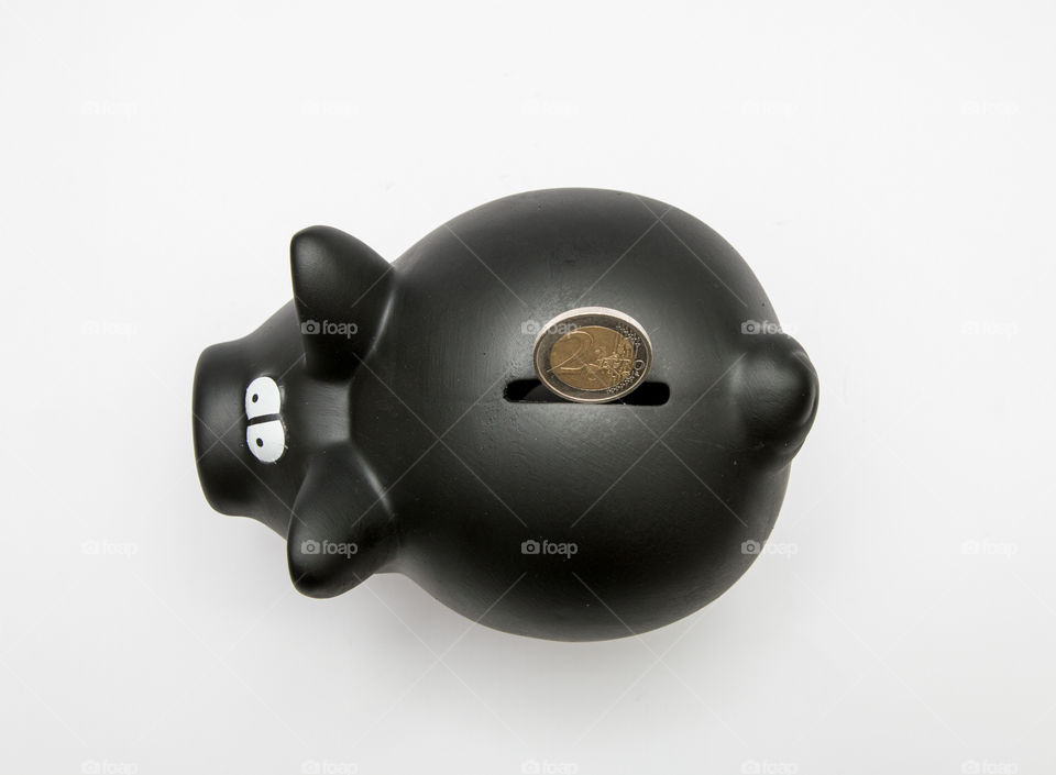 Black Piggy Bank With Coin, Isolated In White Backgound
