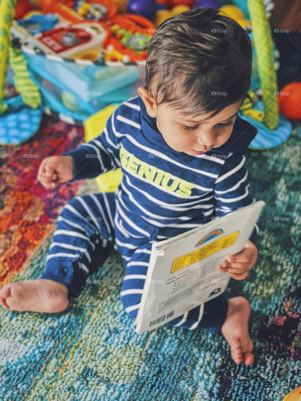 Baby looks at book, baby reads book, playing with books as a kid, babies and books