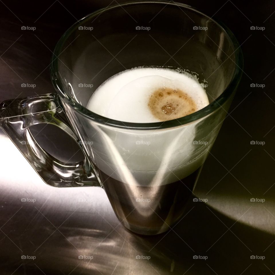 Caffe Latte - coffee with milk in a glass mug 