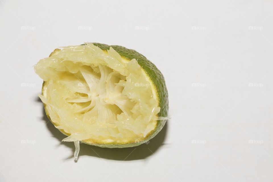 Squeezed lime on a white background