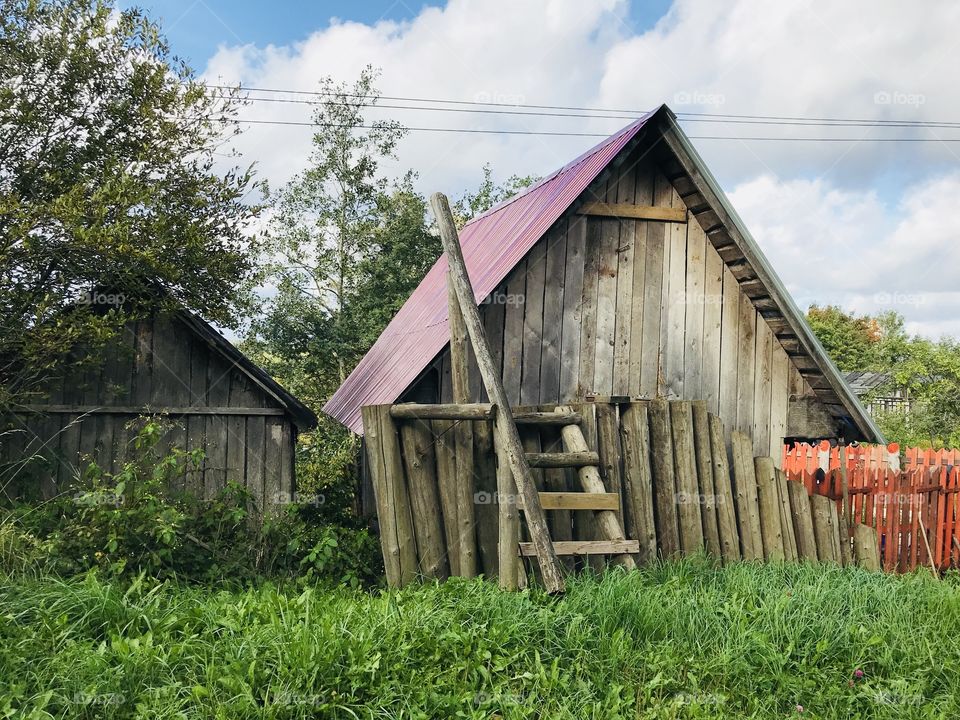 Village street, agricultural buildings and barns along the road. Each such structure in what is unique in its own way and each decorates in its own way.Kuivozi. Vsevolozhsky district. Russia 🇷🇺