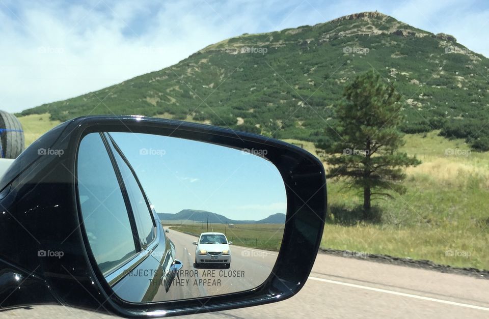 Mirror view on a Colorado highway 