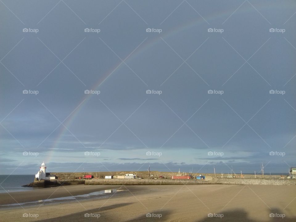 lighthouse and rainbow