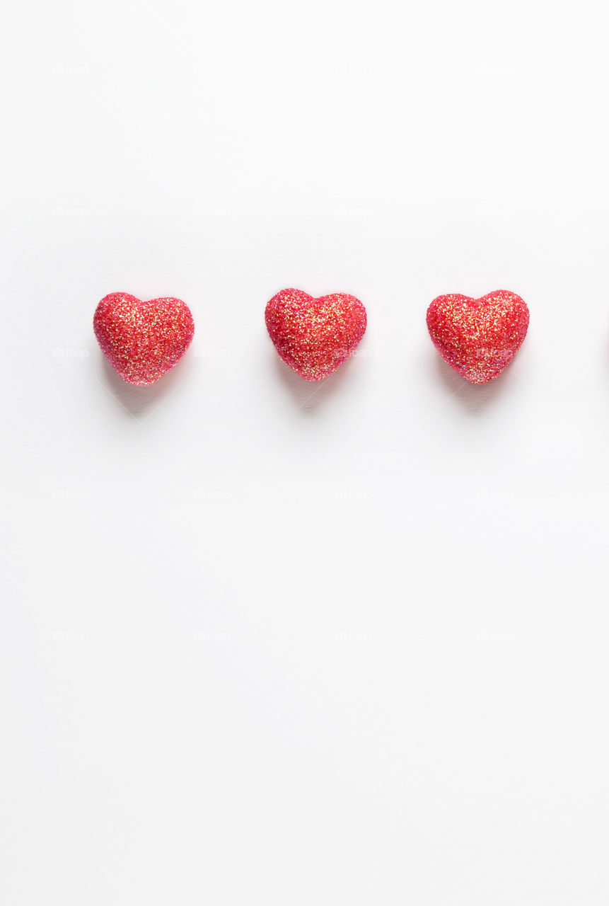Red hearts on a white background. Valentine's Day.