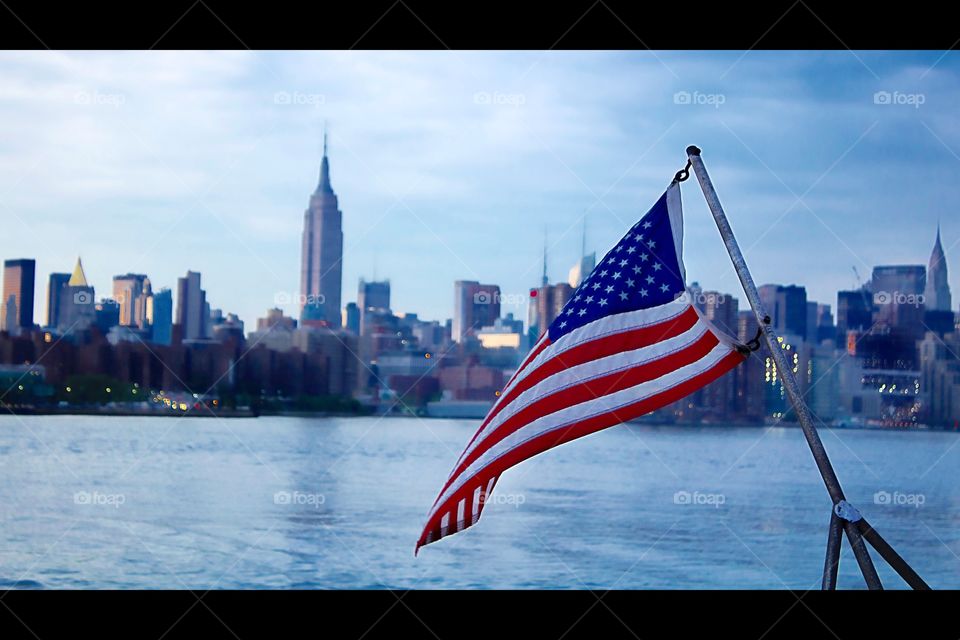 NYC cityscape and flag