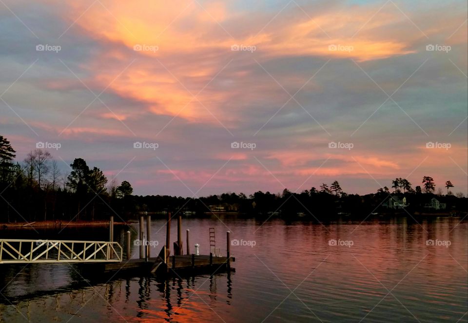 pink sunrise over lake.