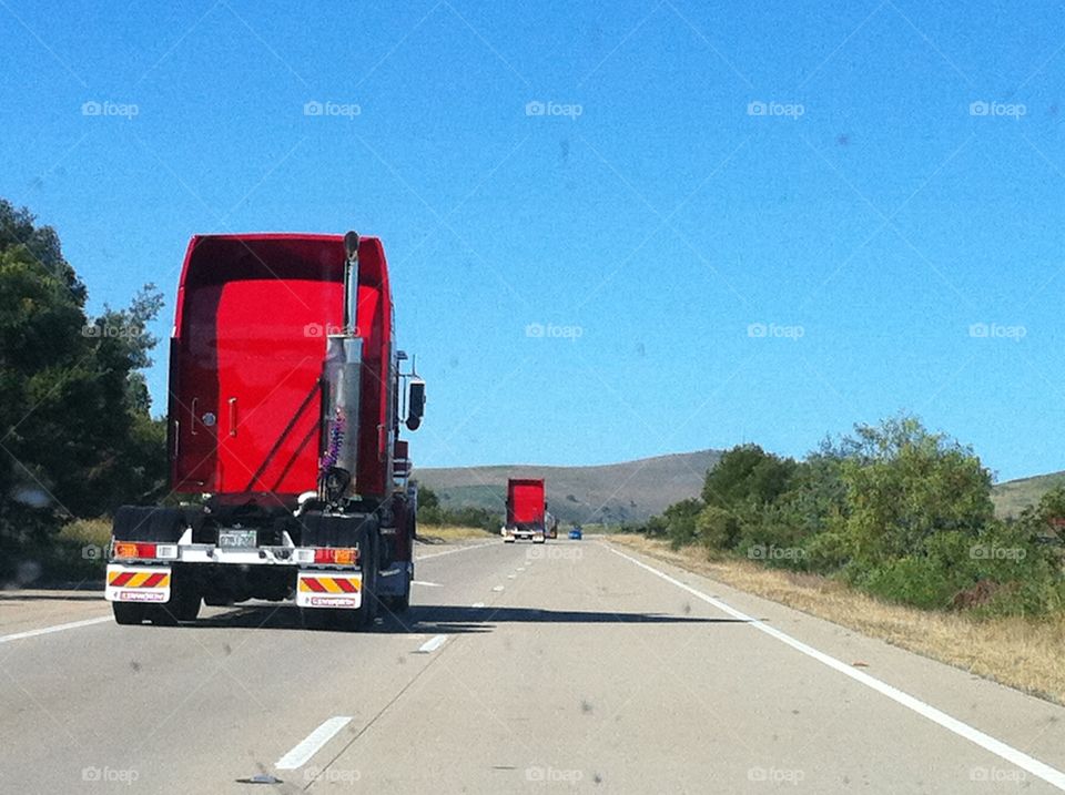 Red trucks on Hume highway Australia
