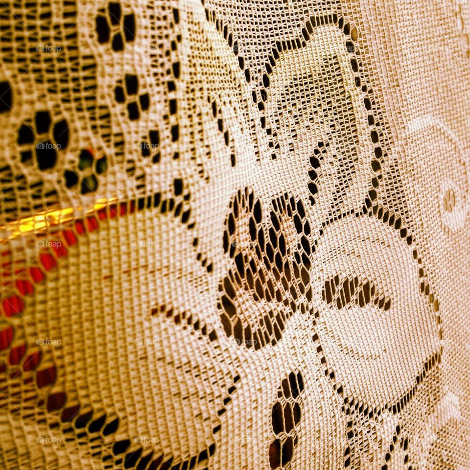 Lace curtain with a lovely flower pattern.