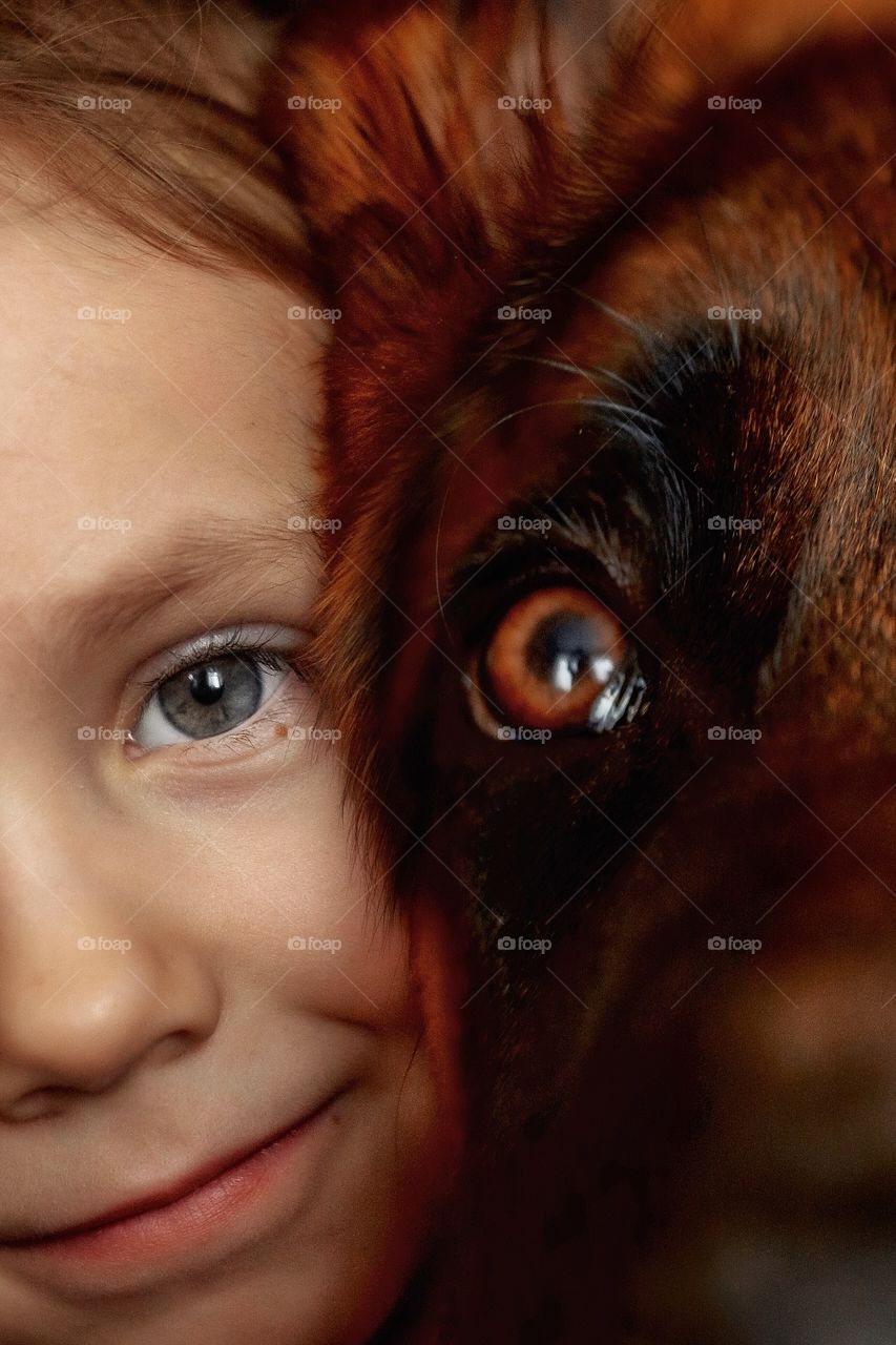 Little girl and German shepherd  portrait with accent on the eyes 