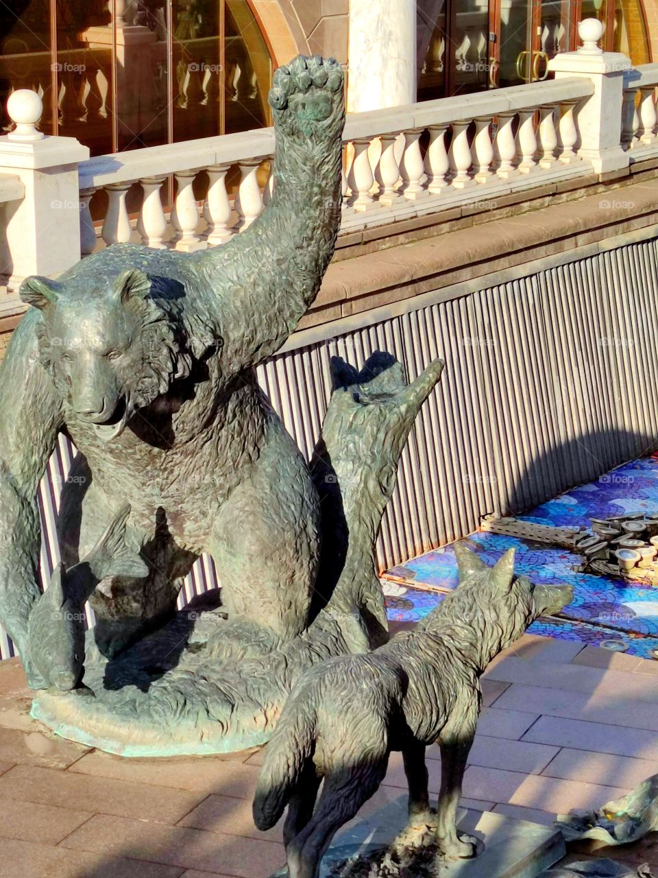 Moscow.  Autumn.  Alexander Garden.  Fountain figures based on Russian fairy tales.  Bear with fish and wolf