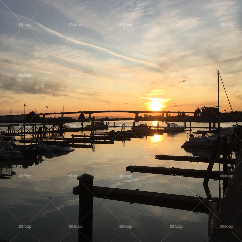 Orange and red Sunset on the Fraser river on a good summer evening