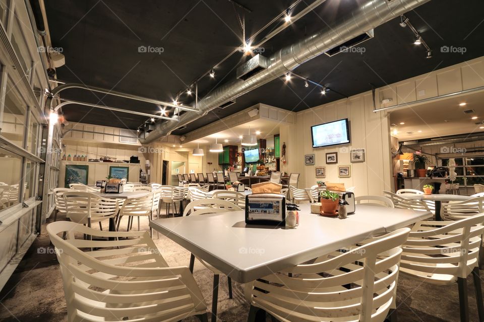 Table inside restaurant at night with nobody 