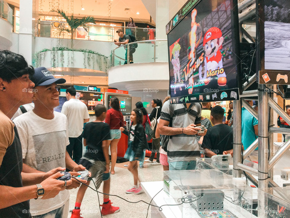 best friends playing the Mario Bros game