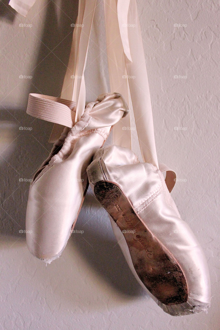 Close-up of ballet shoes hanging