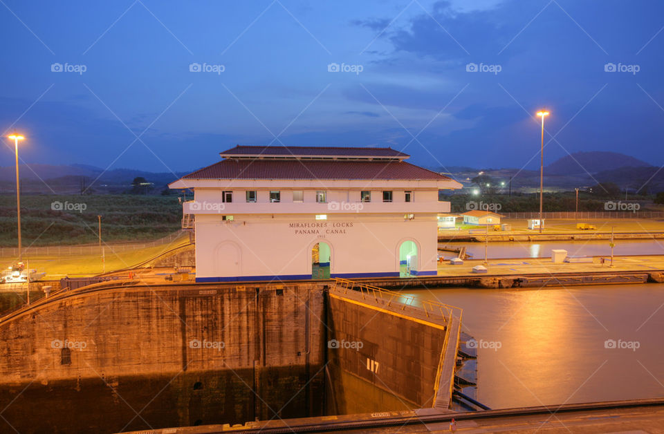 the miraflores locks in the panama canal in the sunset