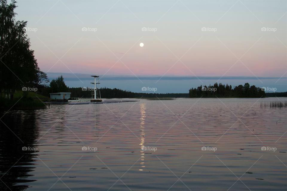 full moon over the water