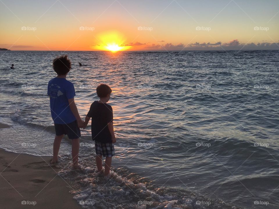 Kids on the beach at Sunset