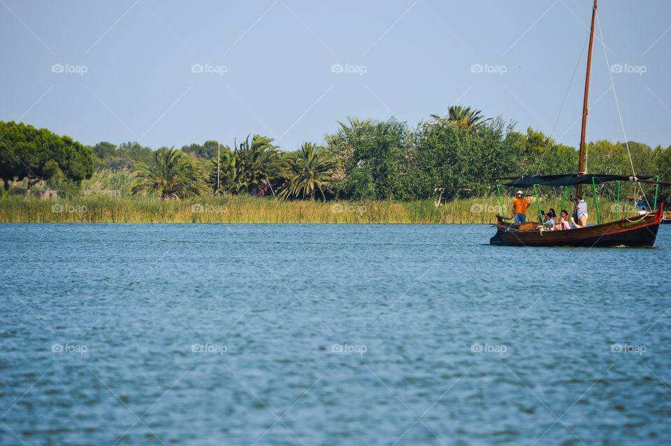 People on boat at lake