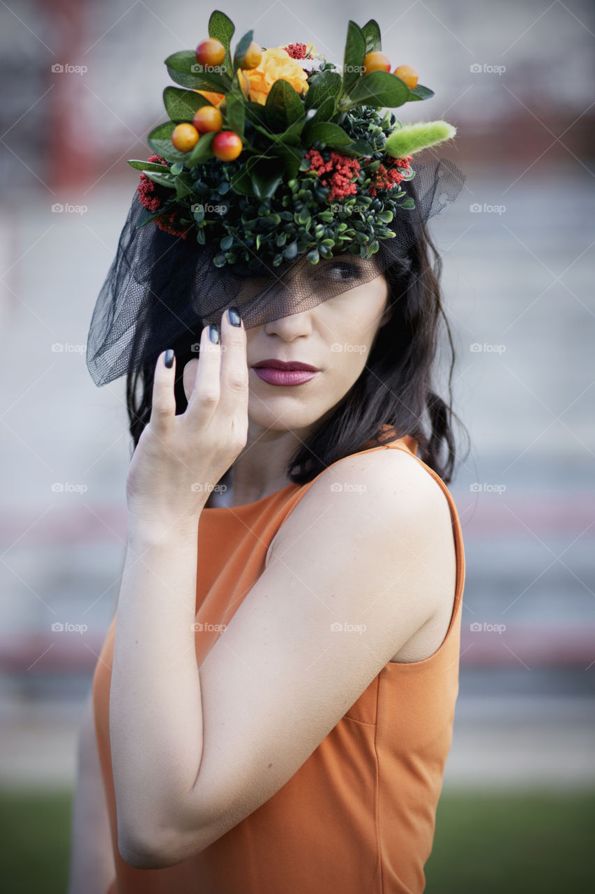 Woman with elegance wearing stand out hat