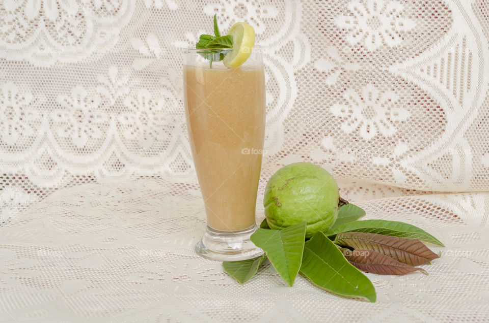 A Drinking Glass Full Of Guava Juice