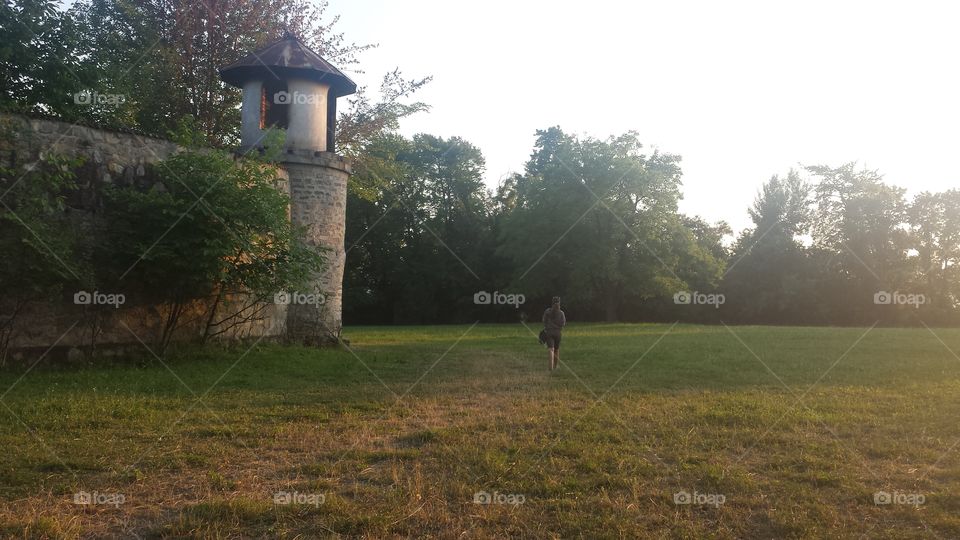 A person walking in grass