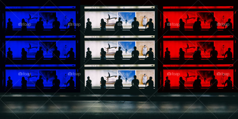 Silhouette of people sitting on bench waiting. French flag background