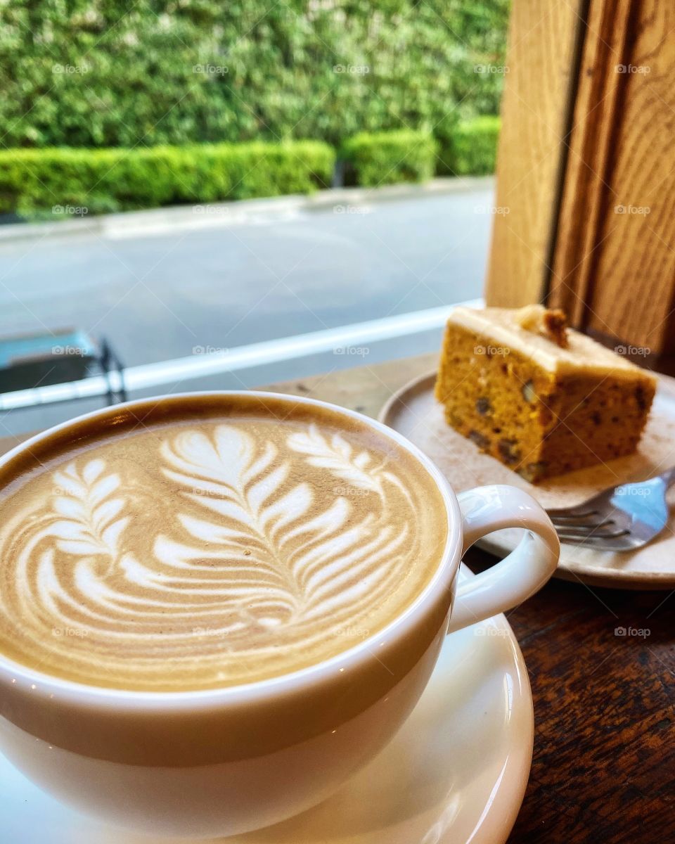 Coffee and carrot cake, a dynamite combination for any time of the day. Beautiful coffee art, an extra treat for the eyes. Take a breather.
