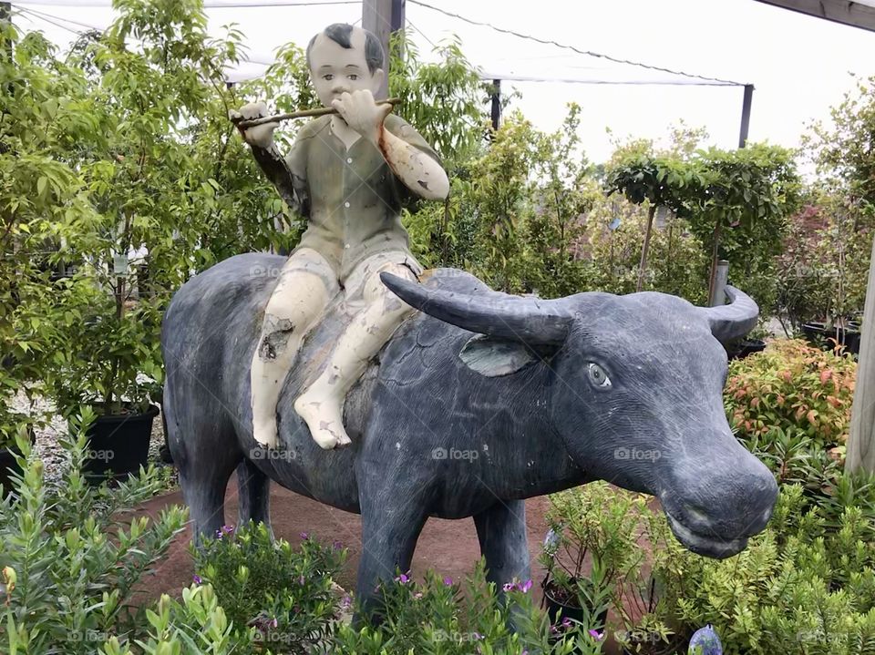 Decorating at Garden Centre with the image of the boy on the Buttfolol Statue