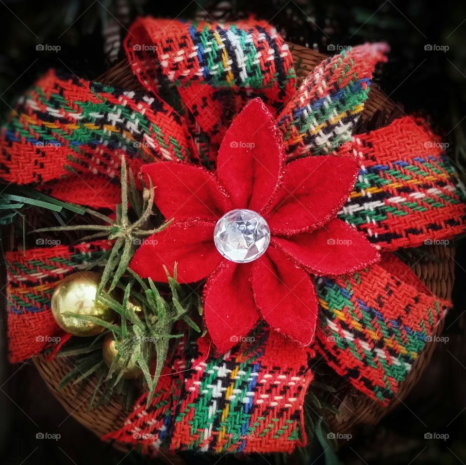 Christmas basket with a poinsettia made of felt and hand woven ribbon