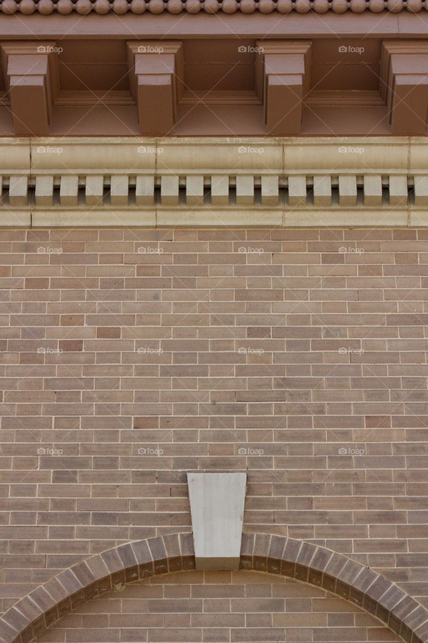 Architectural detail on the overhang and side of an historical building