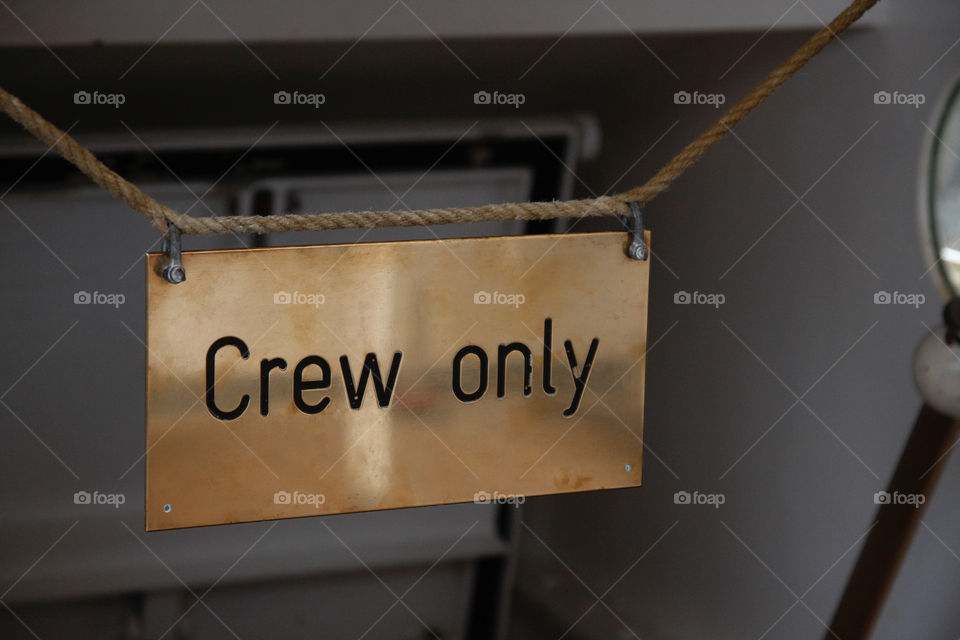 A sign on the ship ‘crew only’