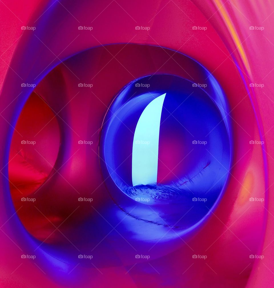 Circular tunnels of a light and air sculpture called the Luminarium 