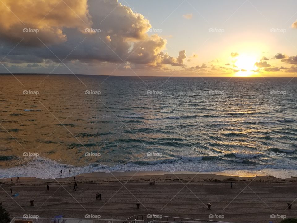 sun setting on the ocean in Miami beach Florida