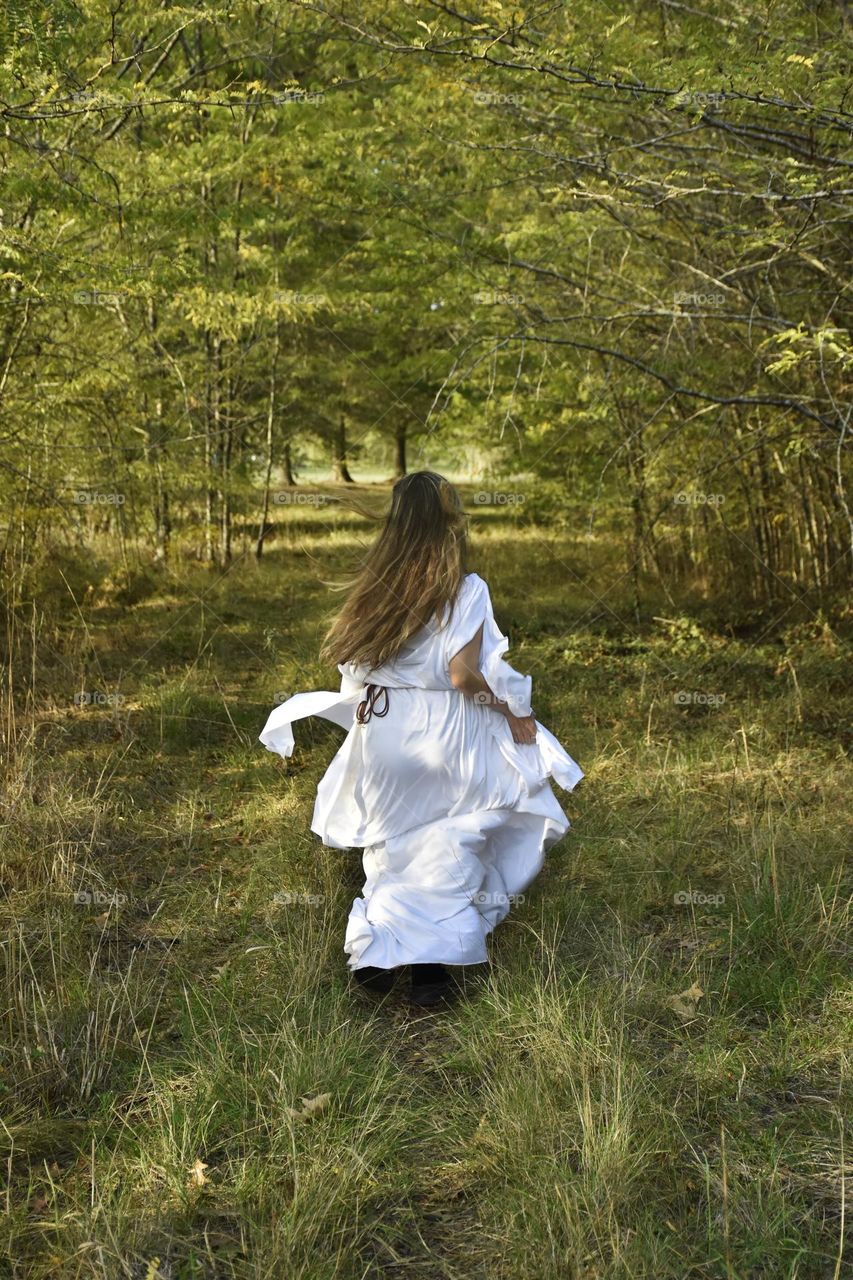 greek goddes running in a forest