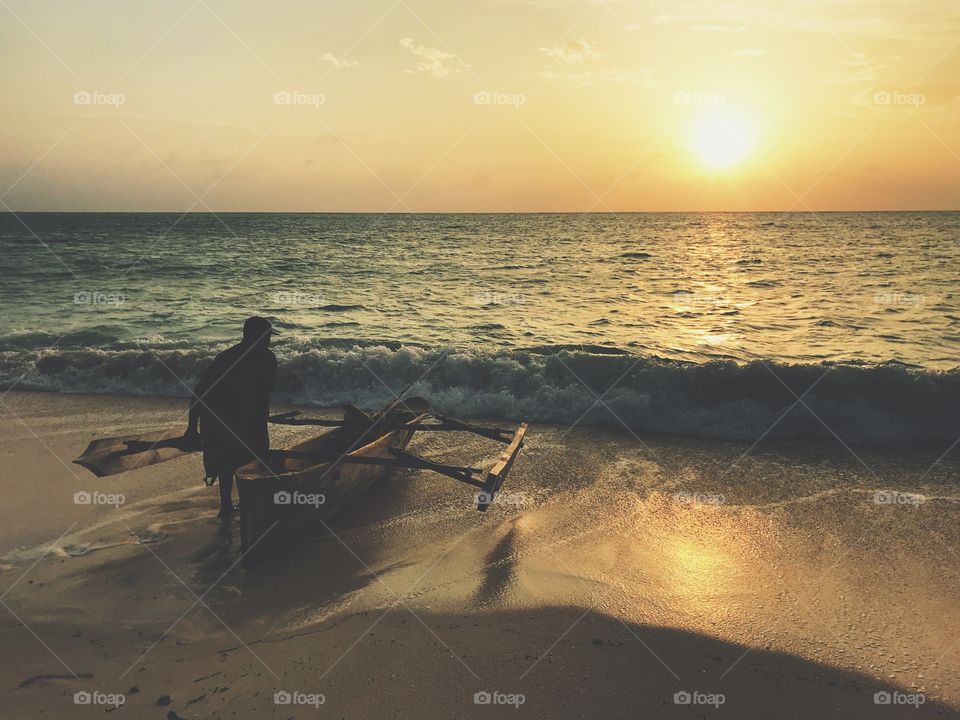 A man going fishing on sunrise