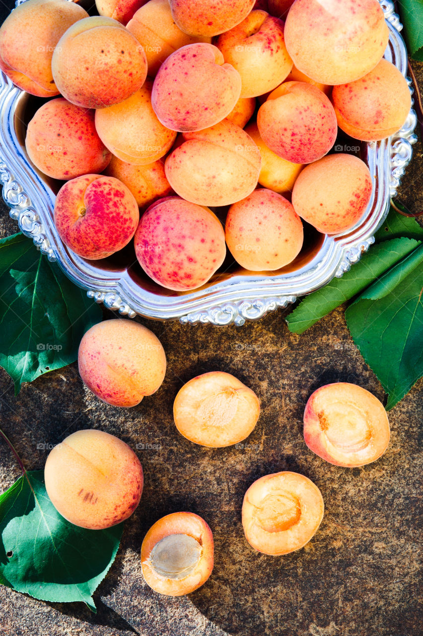 Fresh apricots picked straight from tree in the garden put on wooden table