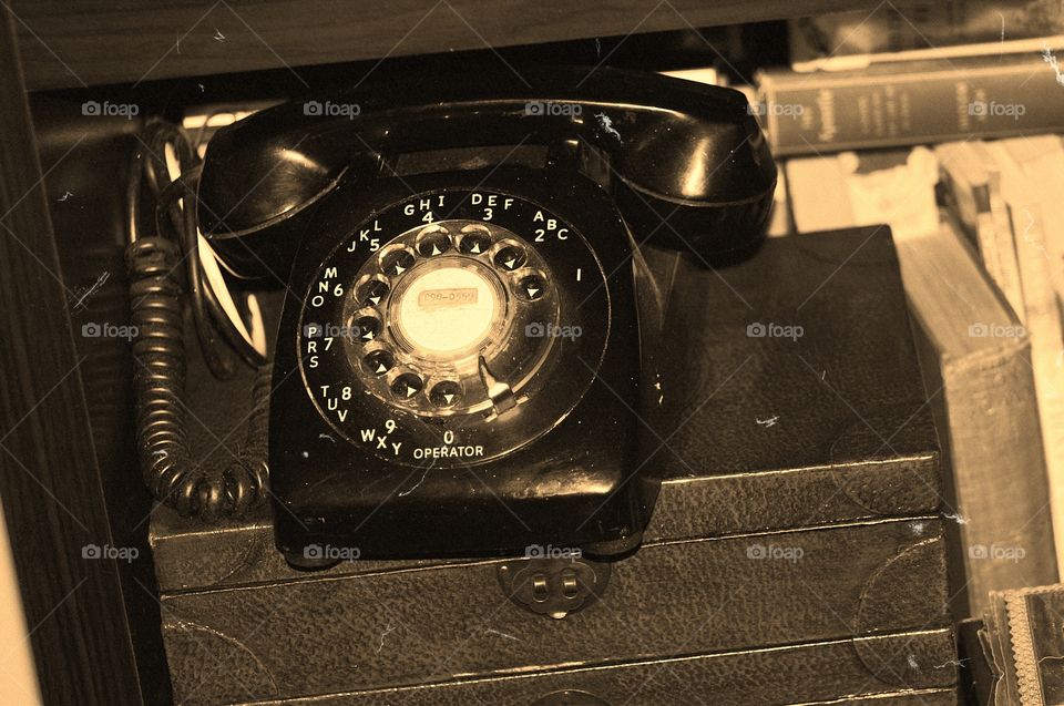 Old black rotary telephone. Old black rotary telephone