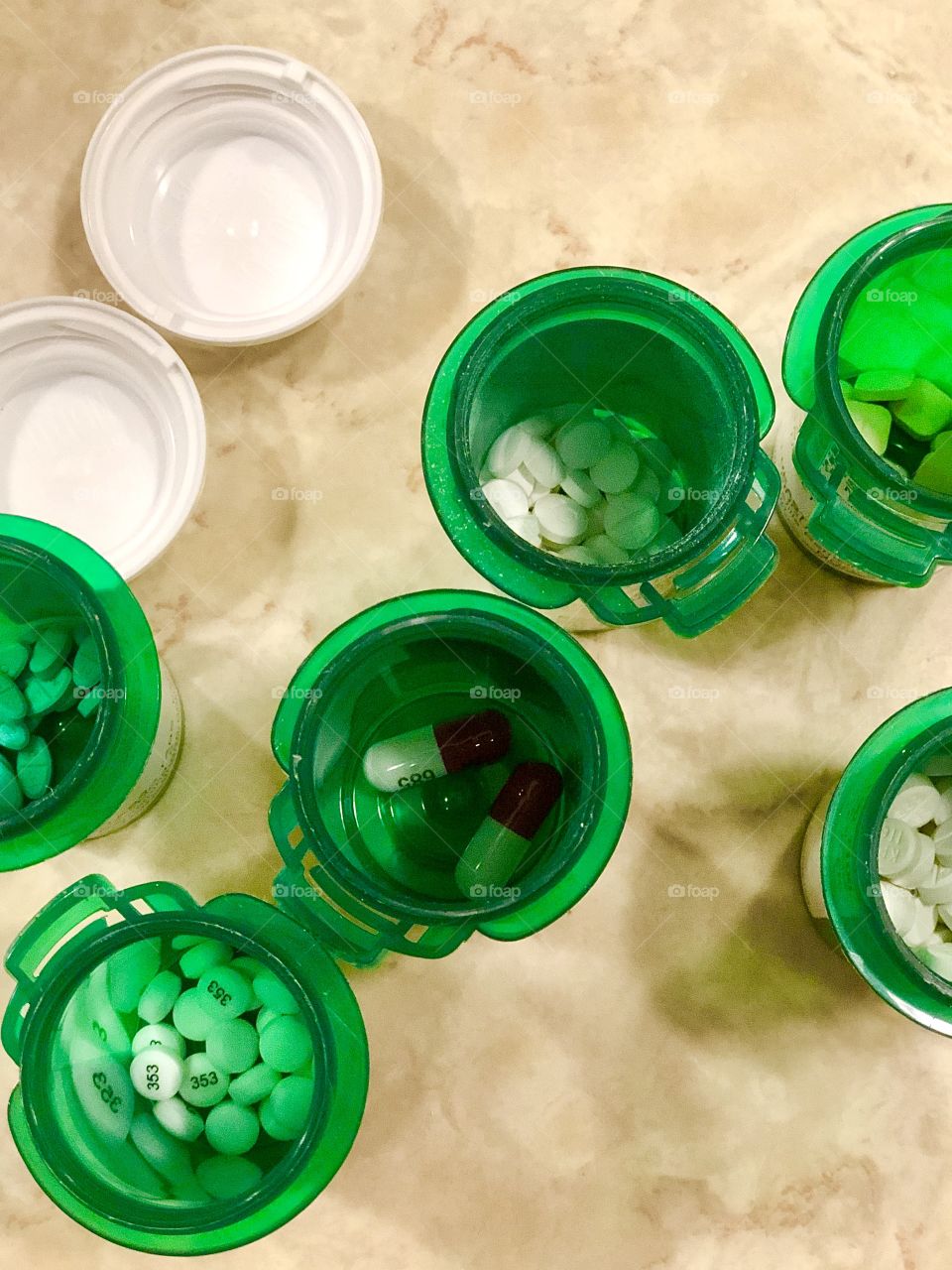 Overhead view of open medicine bottles 