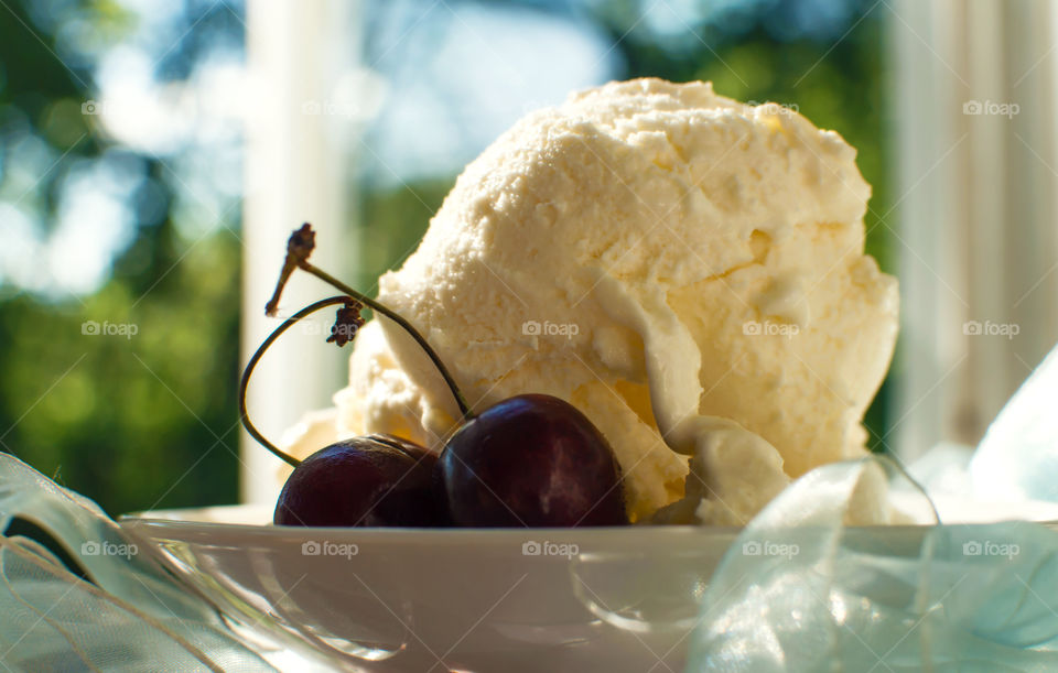 Plate with scoops of fresh vanilla ice cream