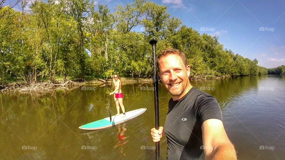 couple paddle boarding