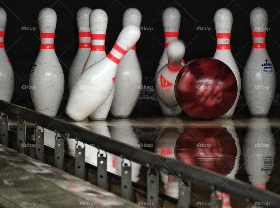 Bowling Strike. Bowling Ball Knocking Down Pins
