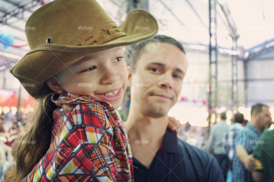 Little girl in country party with daddy