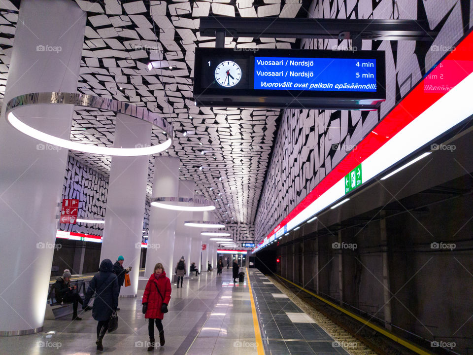 Espoo, Finland - February 20, 2018 - Illuminated billboard announcing irrelugar metro schedule and delays at the newly opened Urheilupuisto metrostation in Espoo, Finland.