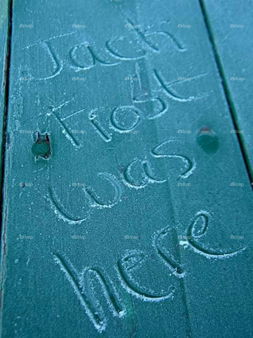 "Jack Frost was here" written in frost on frosted surface