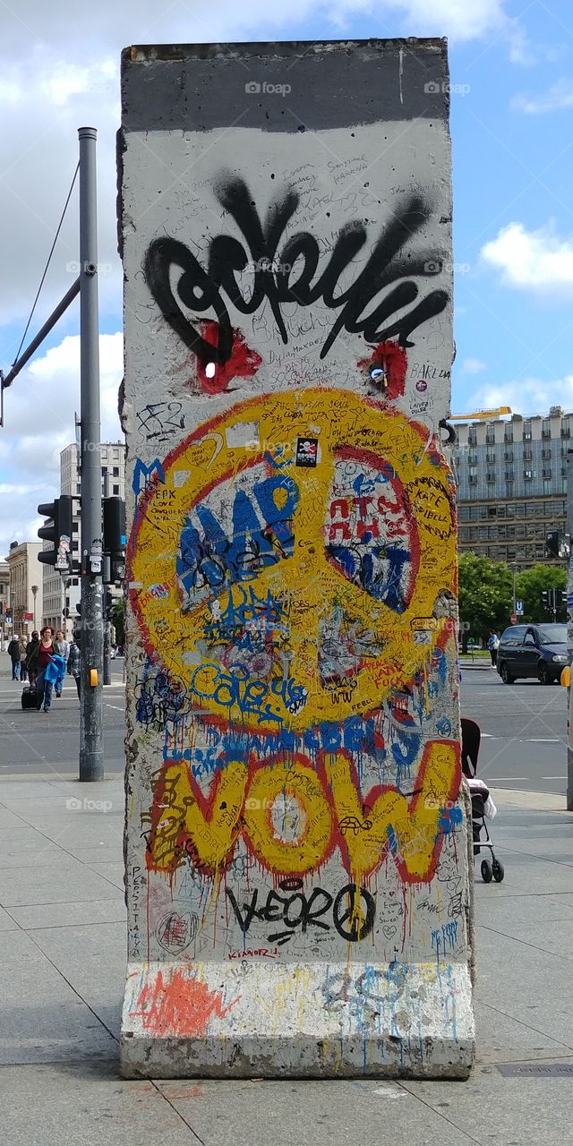 Piece of the Berlin Wall at Potsdamer Platz in Berlin 2017 with Peace Sign
