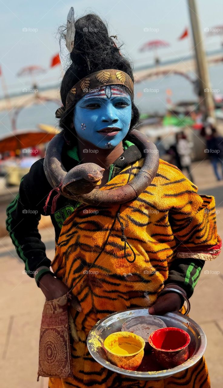 portrait of a boy in costume of lord shiva at Varanasi banaras india