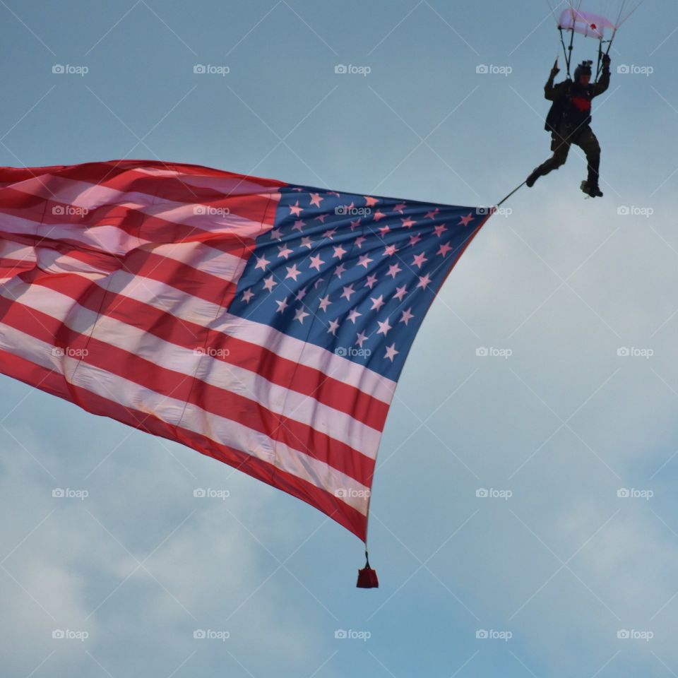 Sky diver with flag.