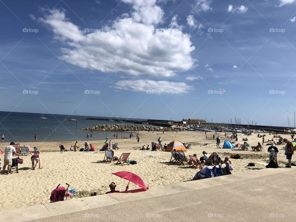A busy day on Lyme Regis’s premier beach, visitors taking advantage of the lovely weather.