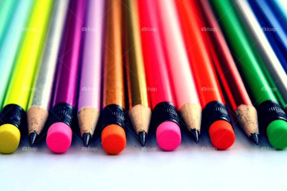 colorful pencils and erasers