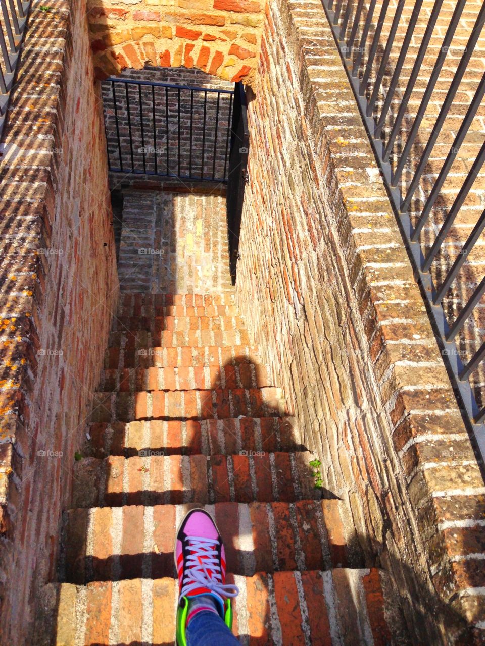 One foot. Ore foot ready to get off the steps 